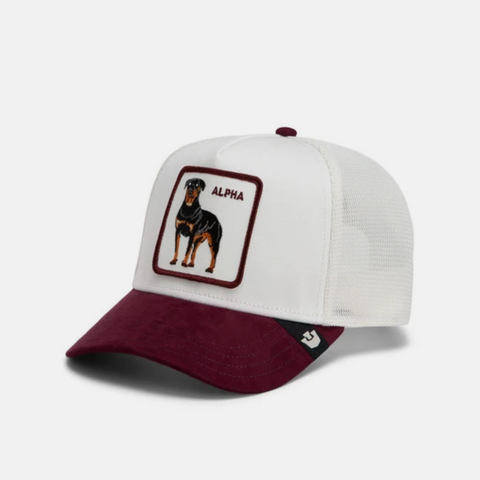 A white and maroon trucker-style cap featuring a custom patch with a black and tan dog and the word 'ALPHA'.