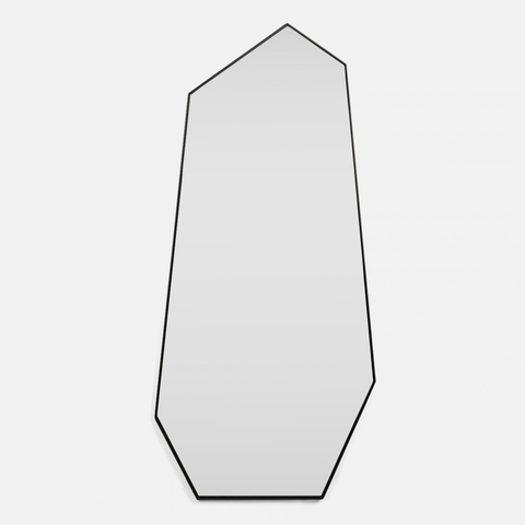 A modern geometric wall mirror with an irregular, multi-sided outline and a thin black border, shown against a light gray background.